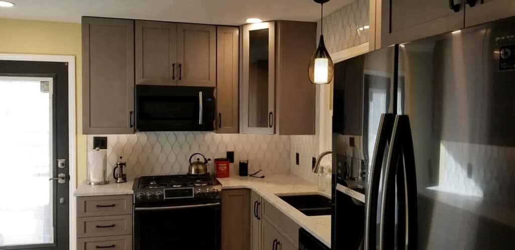 Kitchen with dark cabinets and appliances