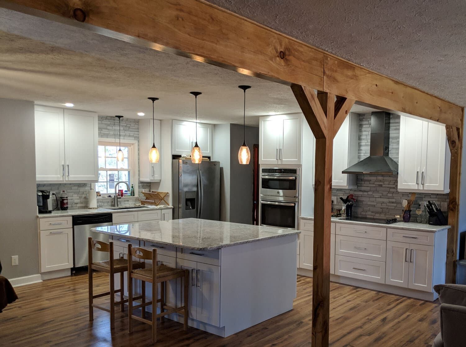 Kitchen interior with wood beam and granite
